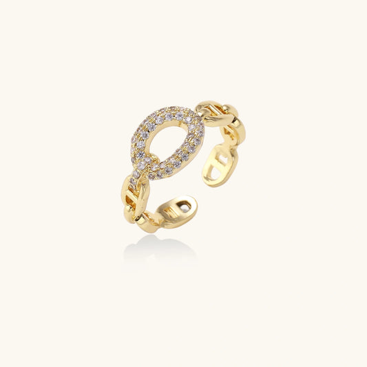 Gold open ring with diamond accents on a white background