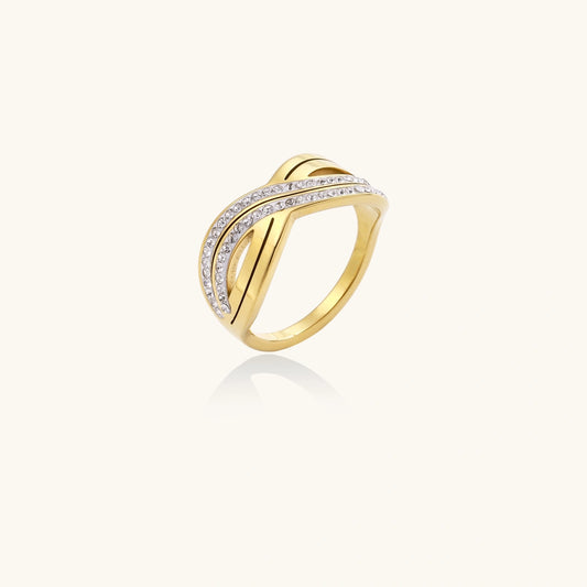 Gold ring with diamond accents on a white background