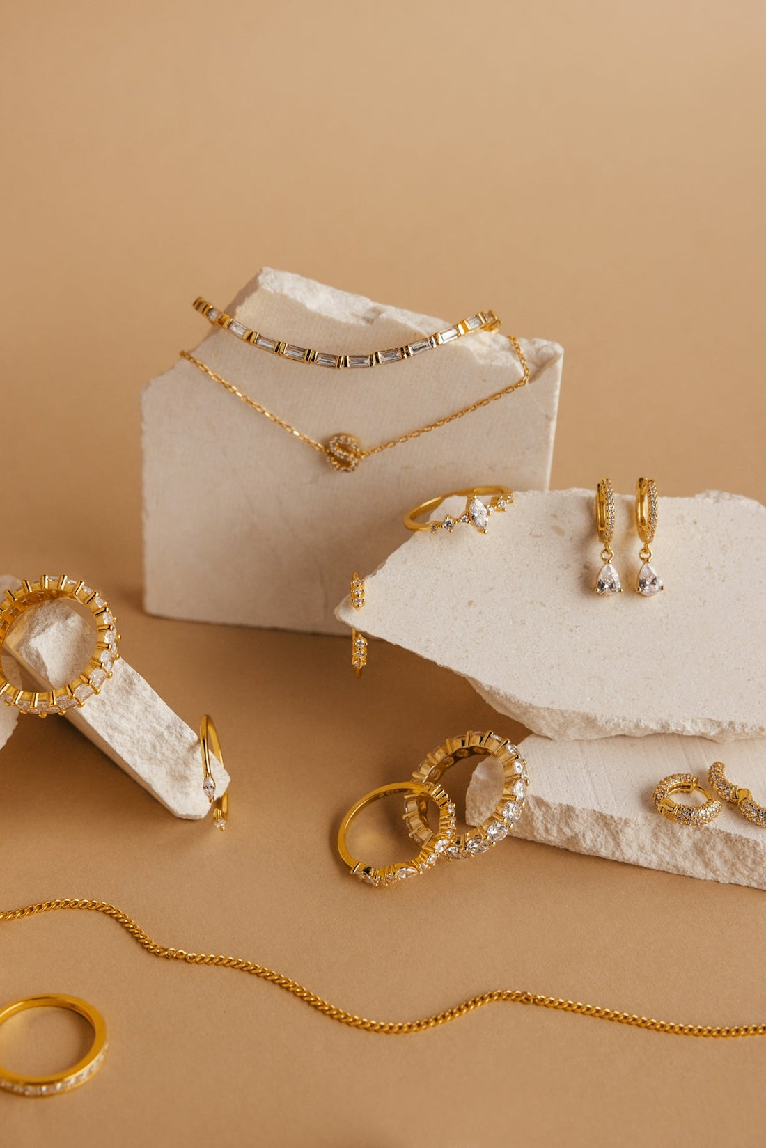 a white box with gold jewelry on it seravine atelier