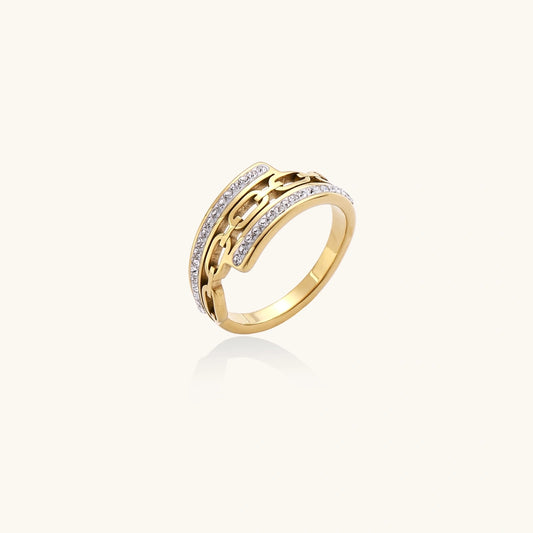 Gold ring with embedded stones on a white background